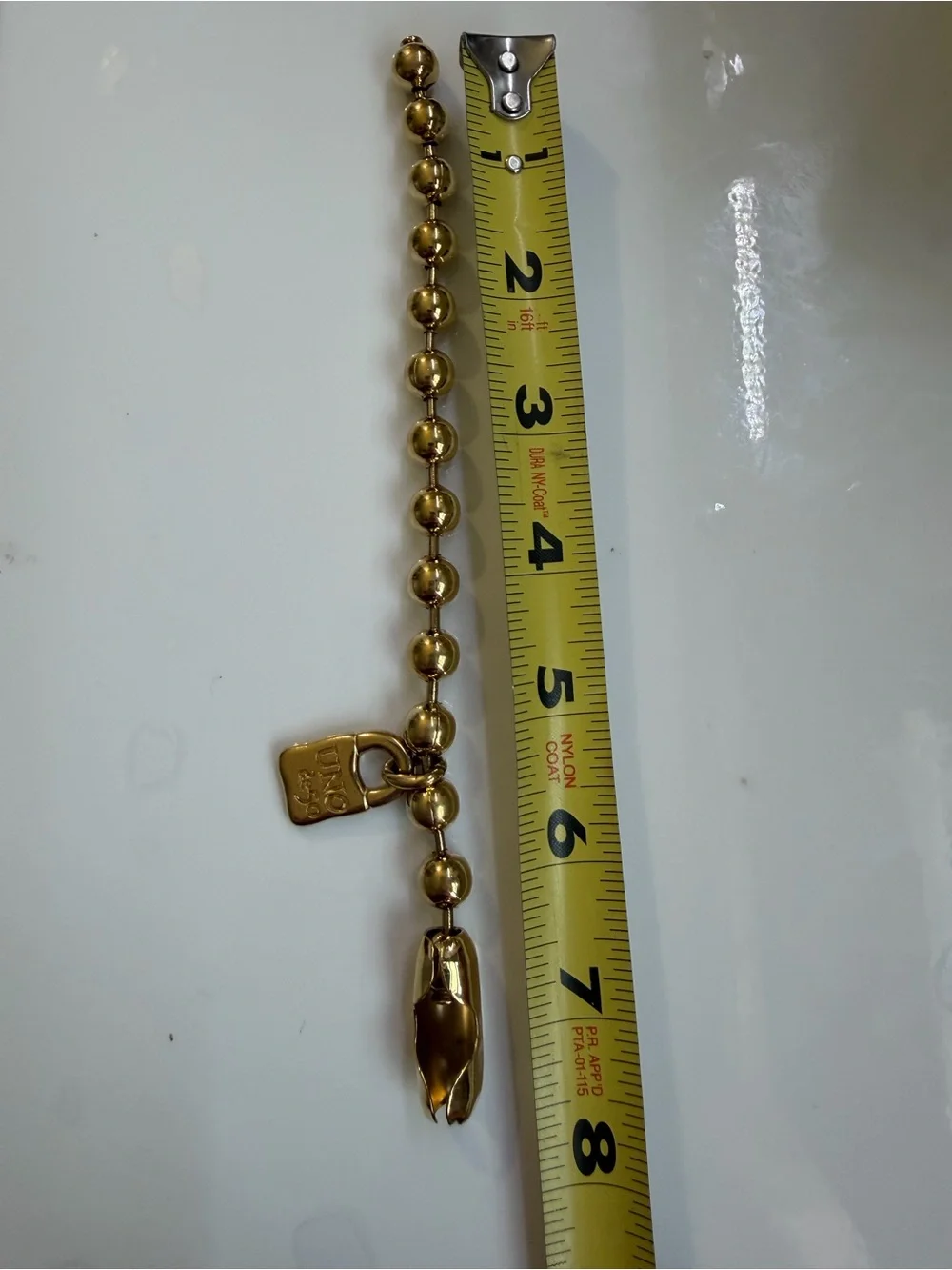 UNO de 50 Gold-Tone Beaded Bracelet with Padlock Charm